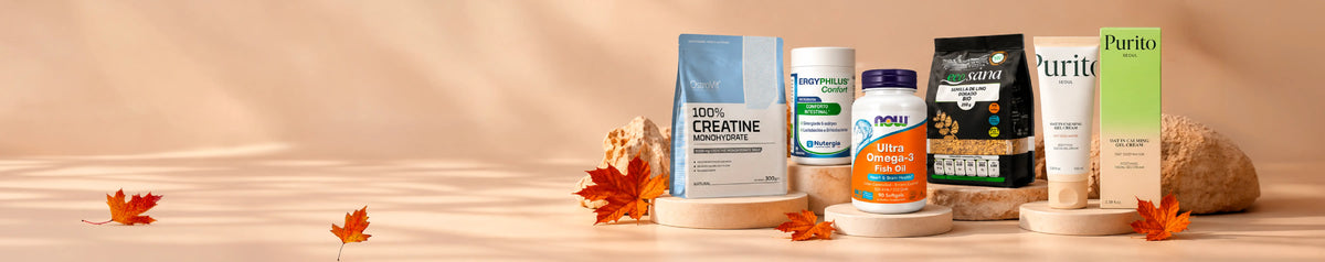 Essenciais de outono com creatina, probióticos, ómega-3, sementes de linho e skincare Purito, num cenário em tons quentes com folhas.